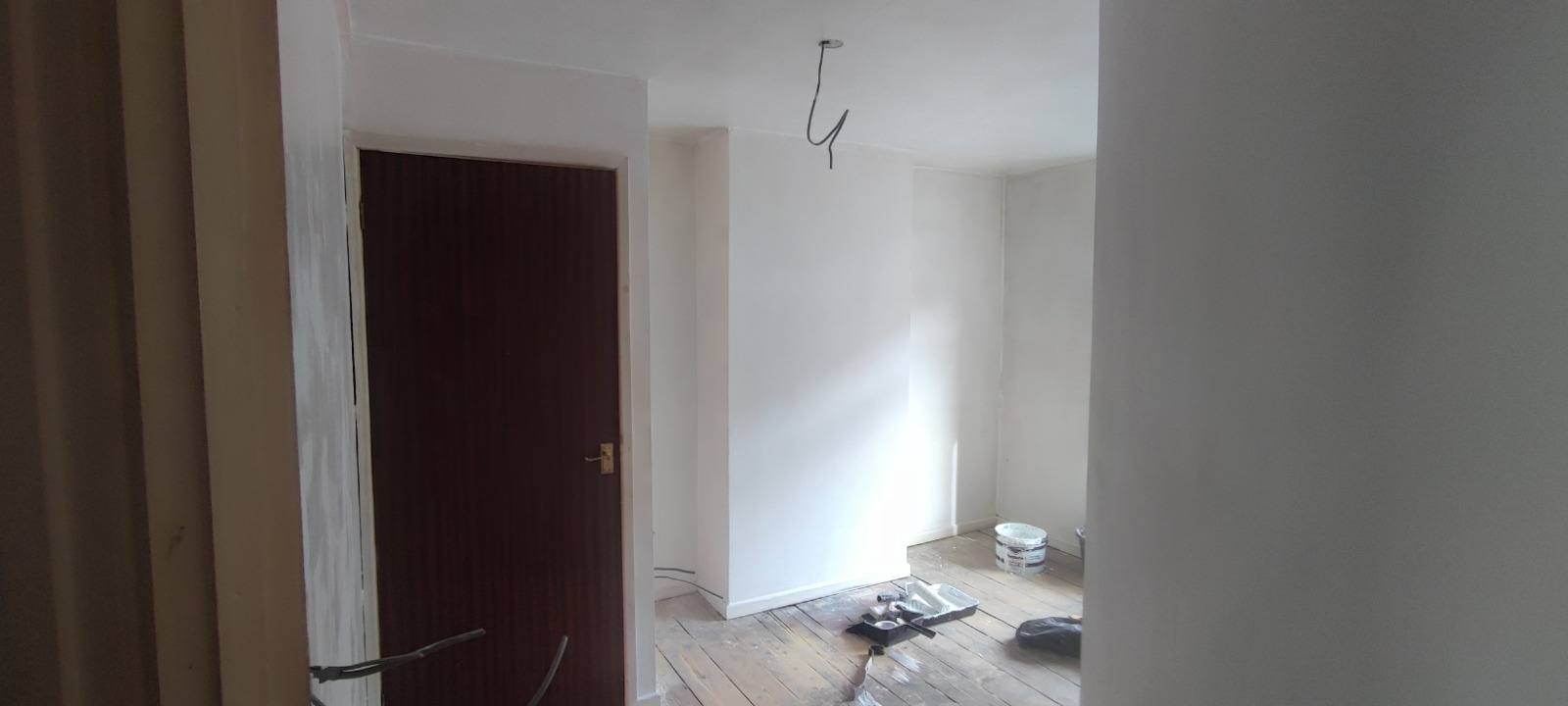 Repainted living room with new internal door — South Wales decorating