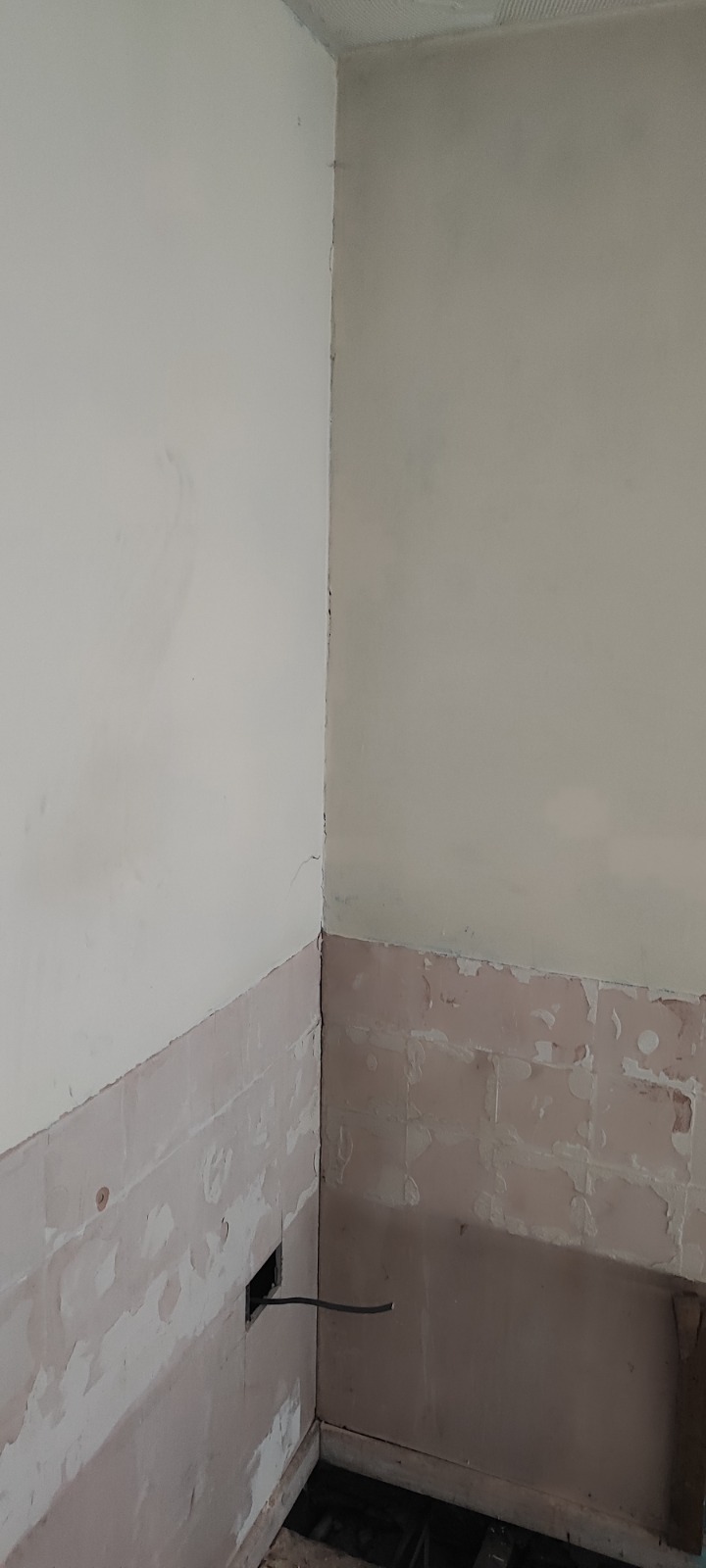 Bathroom rip-out in progress — floor lifted ready for new install, South Wales