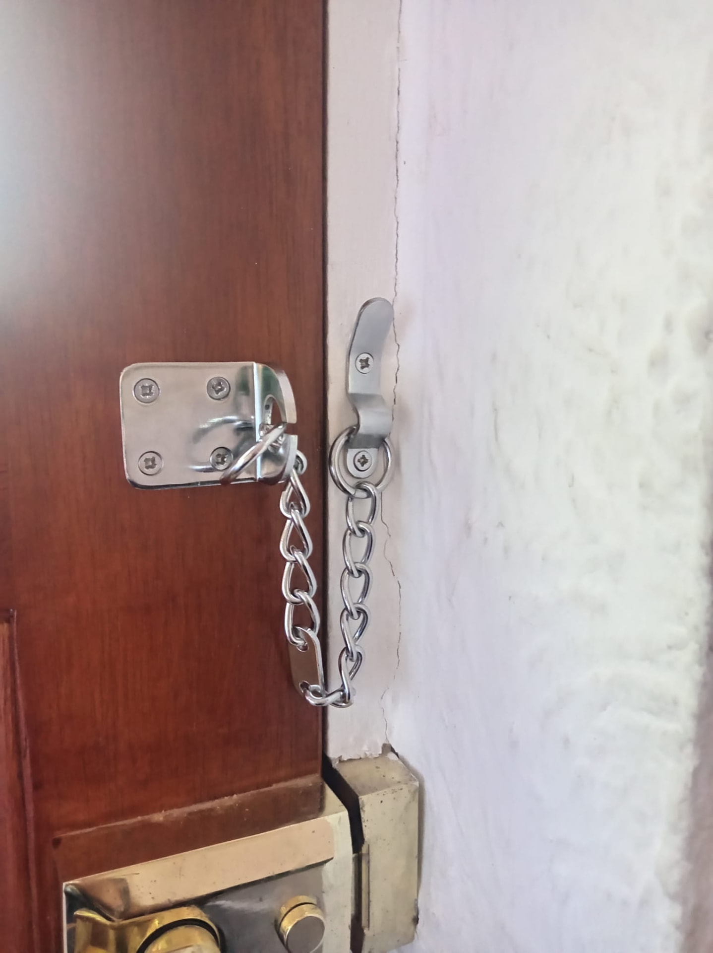 Security door chain fitted to a front door — Newport handyman install