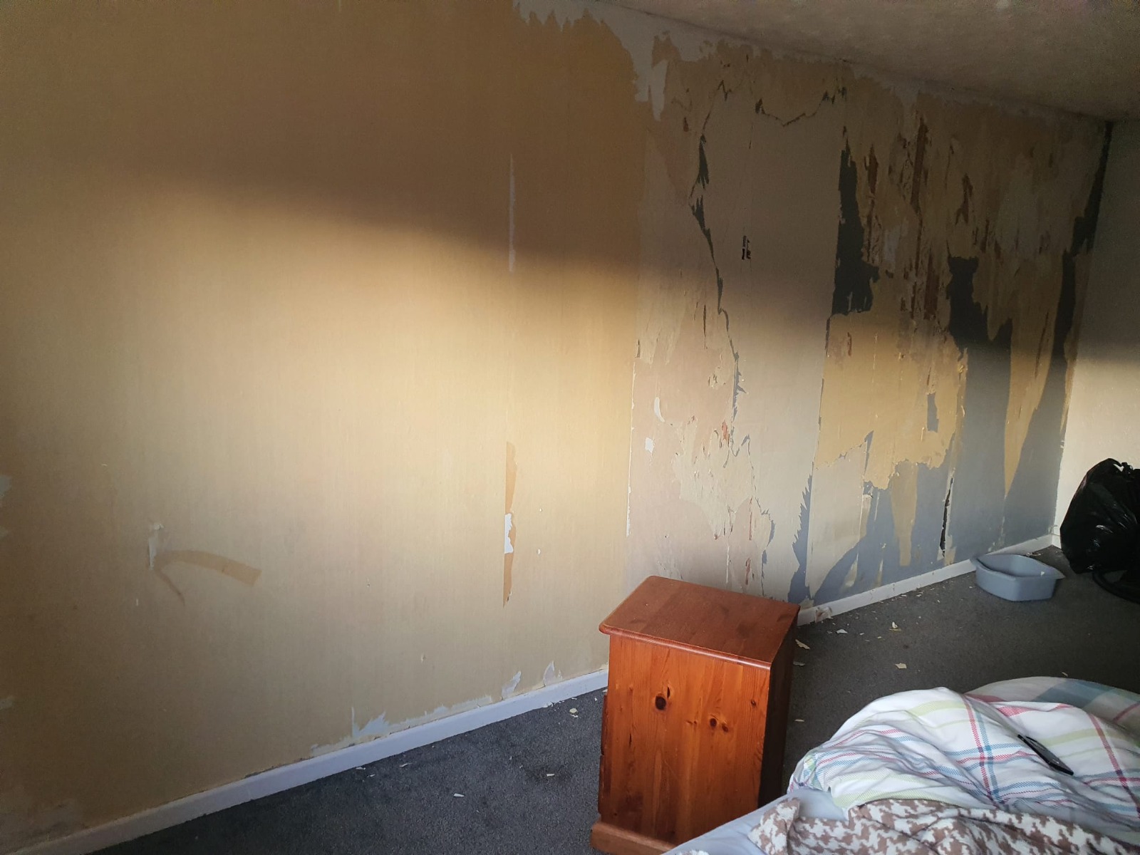 Bedroom wallpaper stripped back ready for replastering — South Wales