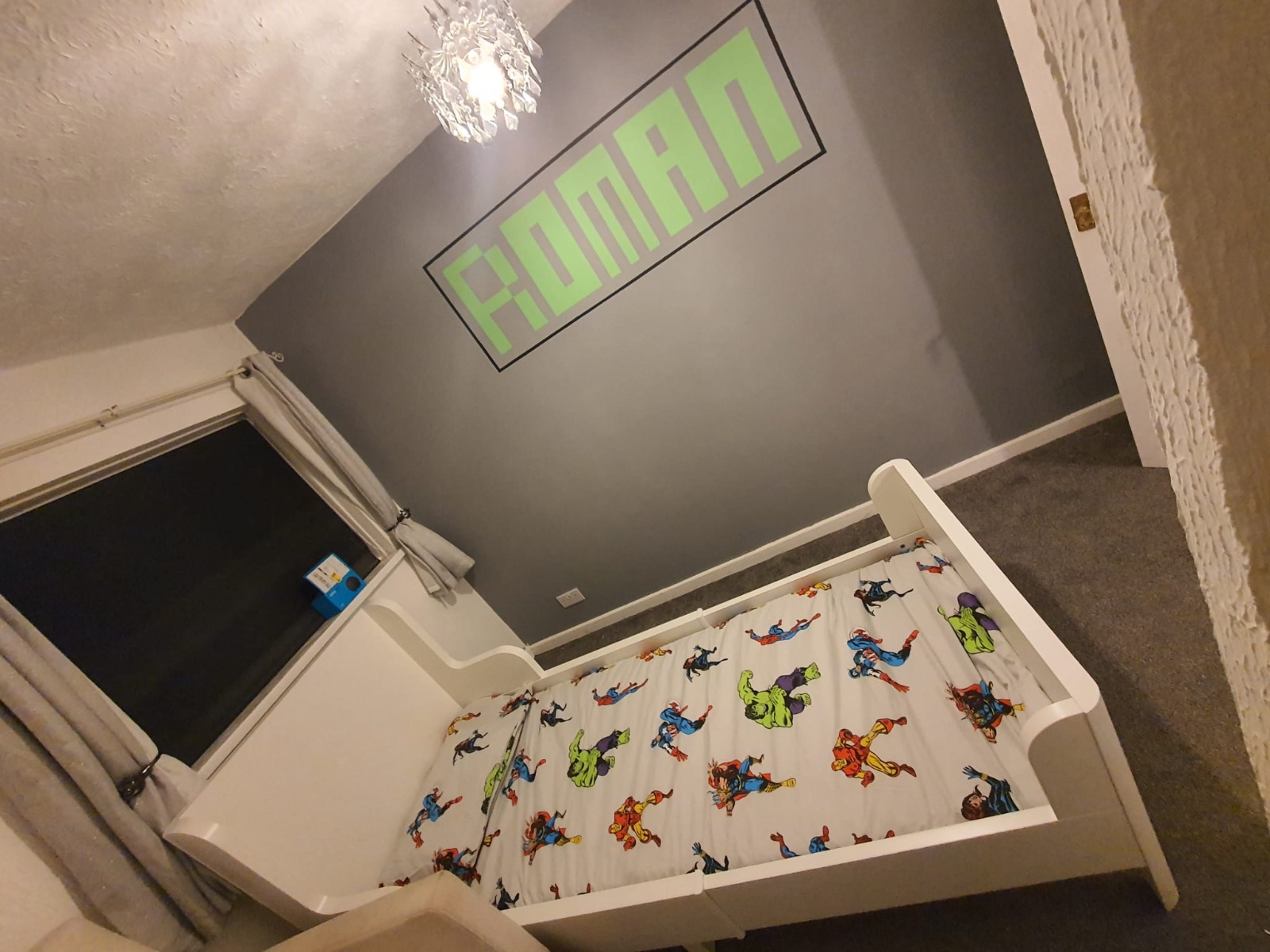 Children's bedroom with bespoke painted feature wall complete — South Wales