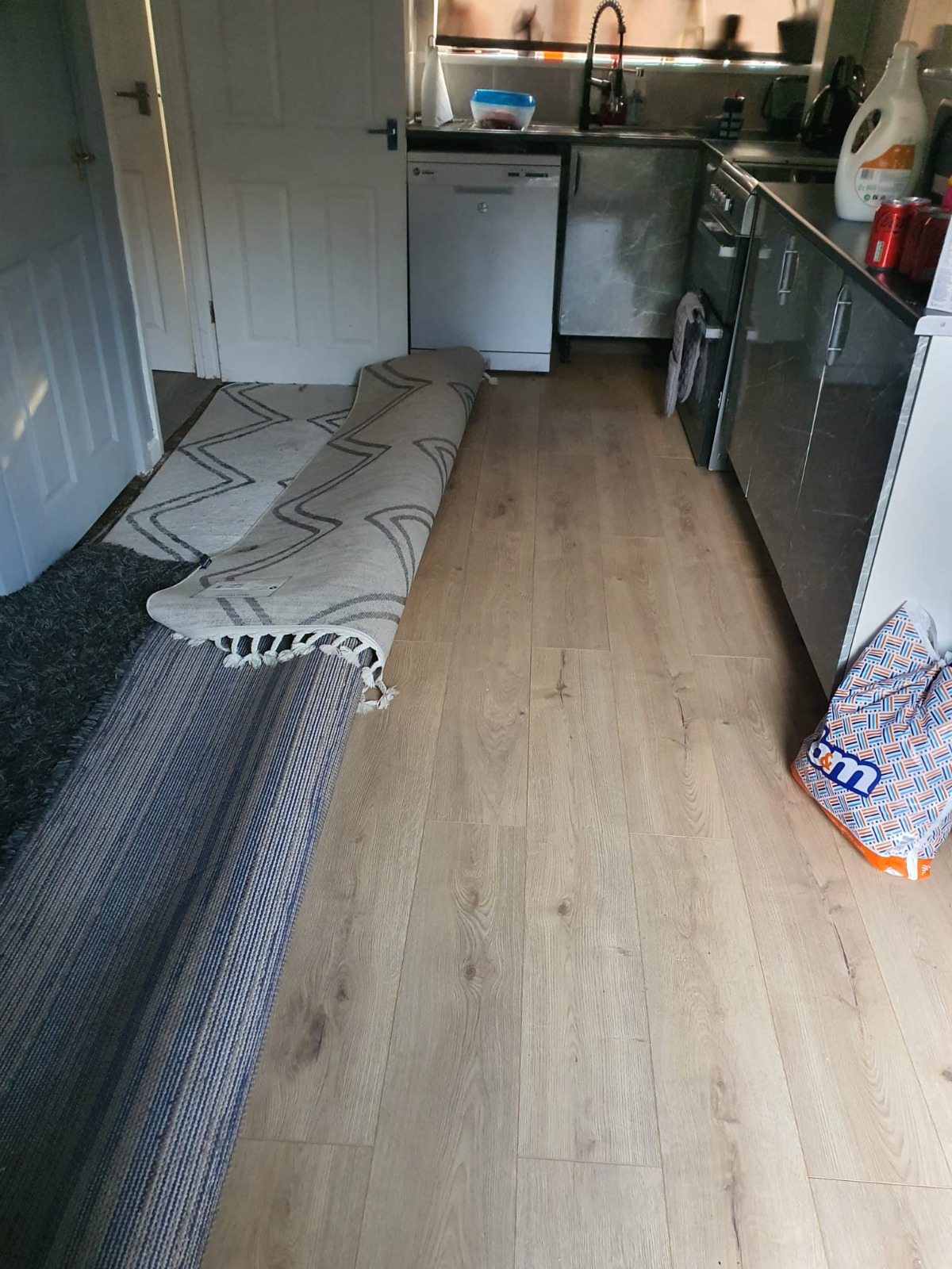 Kitchen-diner with newly laid wood-effect flooring — Cwmbran refurbishment