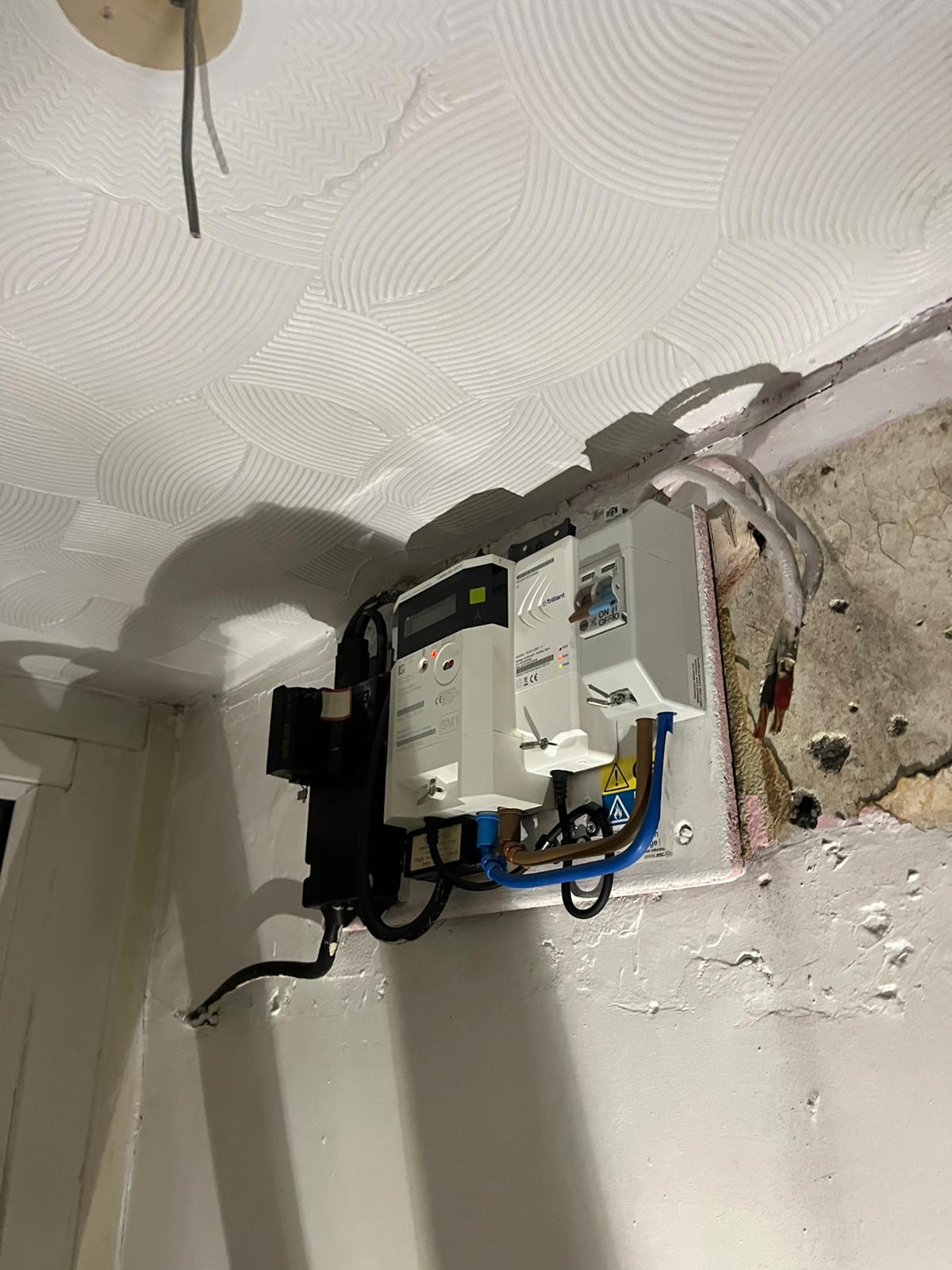 Consumer unit and wiring exposed during electrical works — South Wales