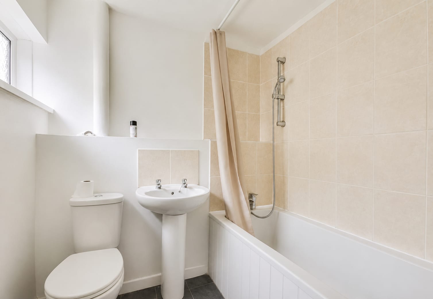 Finished family bathroom with new suite — South Wales refurbishment