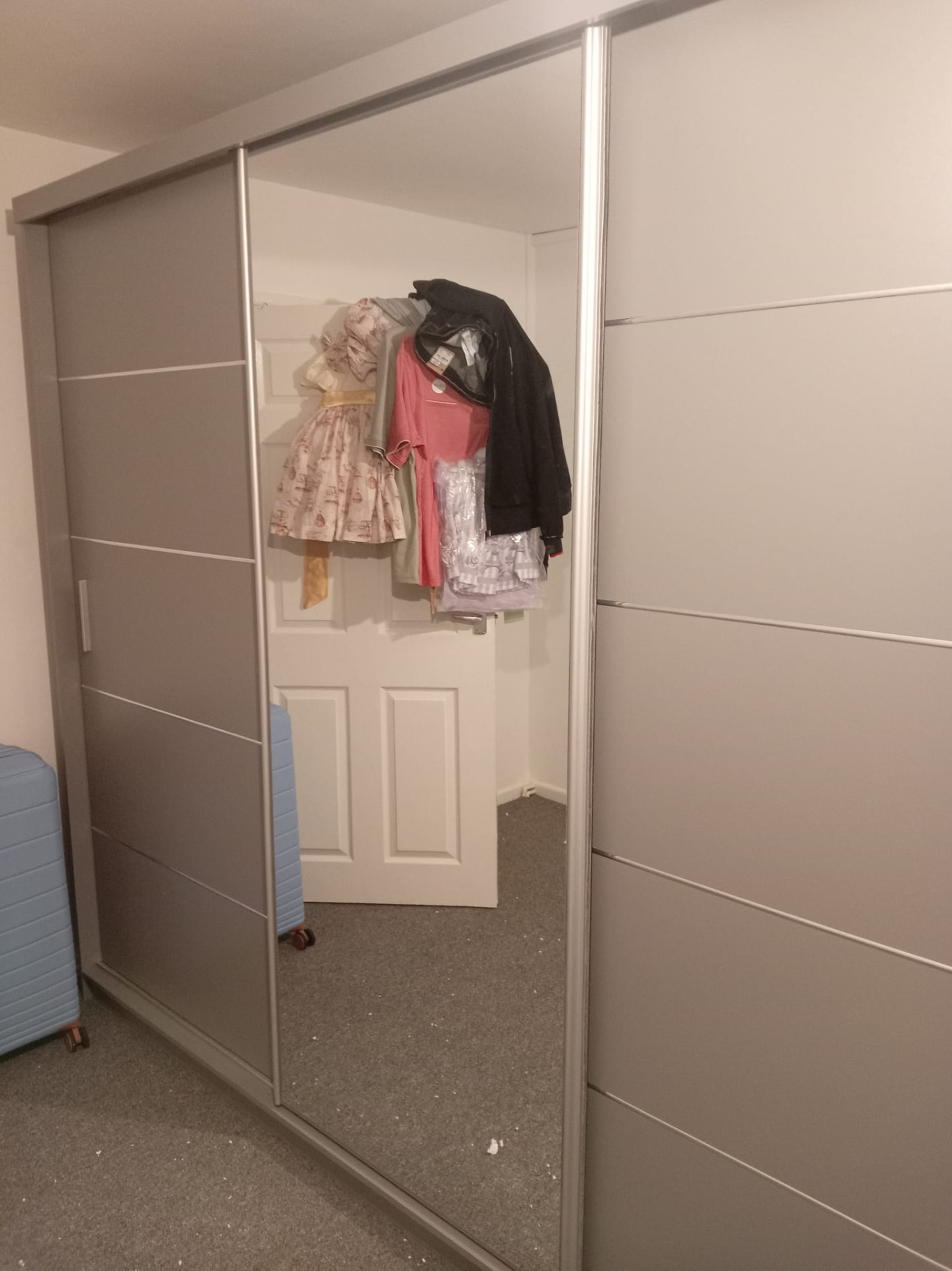 Mirrored sliding-door wardrobe completed and levelled — South Wales flat-pack assembly