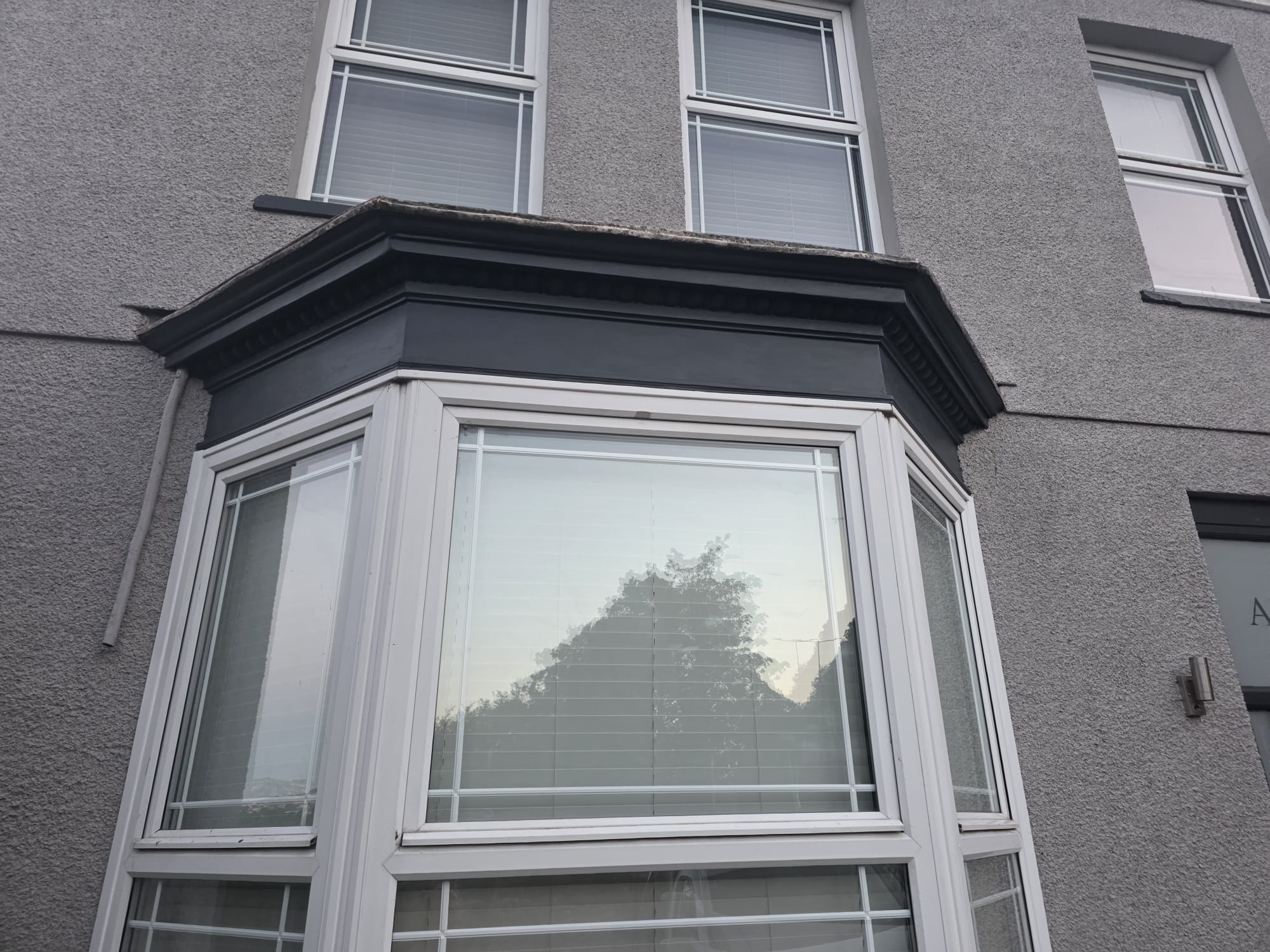 Front elevation bay window finished in dark grey — South Wales exterior painting